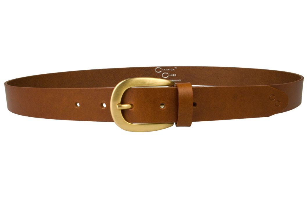 Womens Tan Leather Belt With Brushed Gold Buckle. Made In UK By British Craftsmen. High Quality Italian Full Grain Vegetable Tanned Leather. High Quality Hand Brushed Gold Plated and Lacquered Buckle. 3cm Wide. Champion Chase Horse Shoe Motif to Tip of belt.